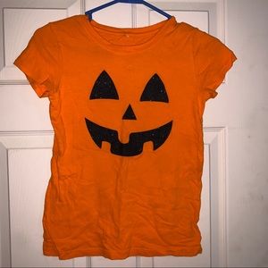 Sparkly Jack-o-lantern face tshirt.